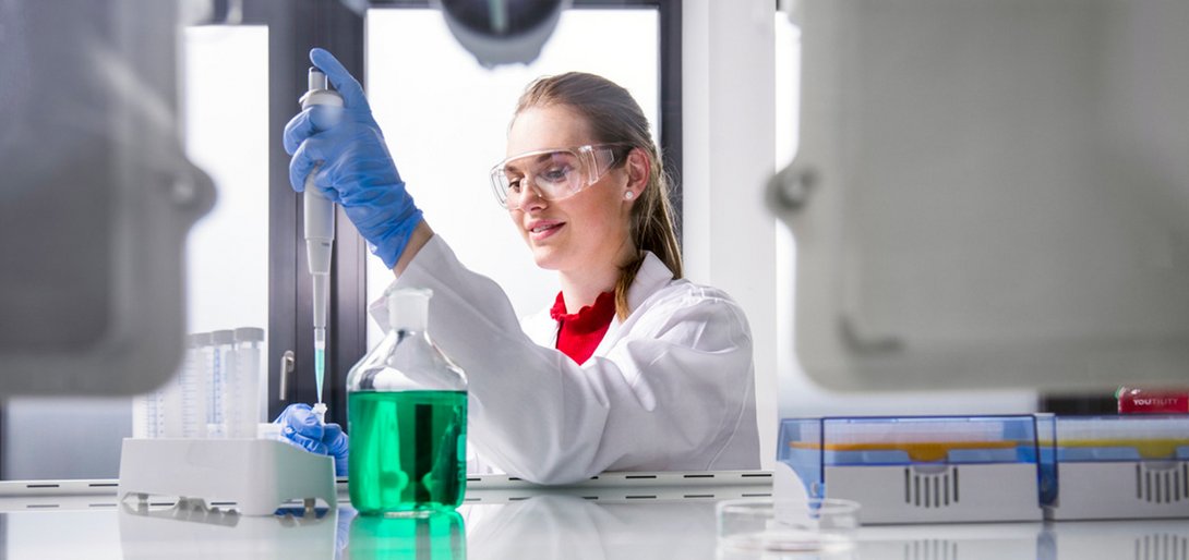 Lab technician with safety goggles in the lab