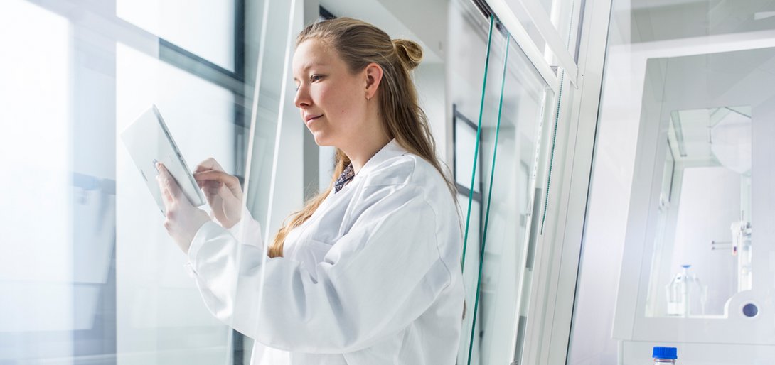 Employee at the tablet in the smart lab